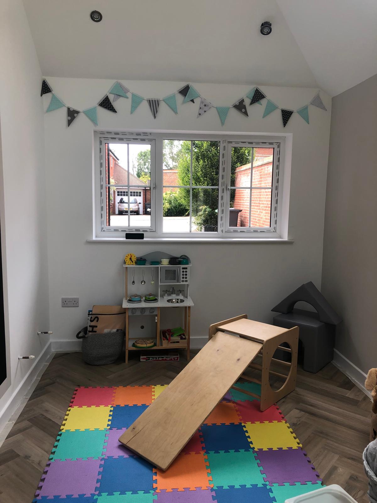 Finished room viewed towards the new front window with herringbone LVT flooring — Huxley Close